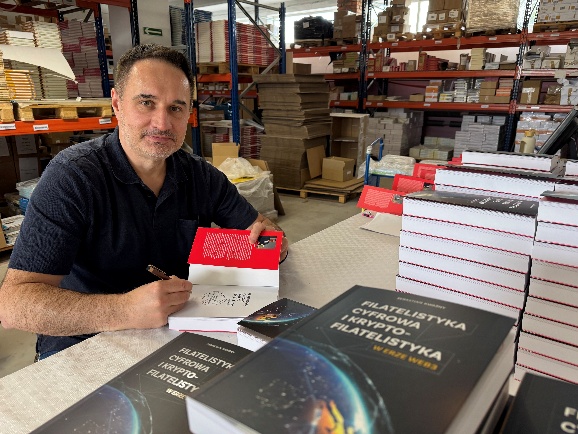 The author signing copies of the first edition